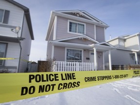 Police keep continuity on a home in the 0-100 block of San Diego Way NE in Calgary, Alta., on Tuesday, Dec. 6, 2016. Their reason for being at the home was not immediately made availalbe. Lyle Aspinall/Postmedia Network