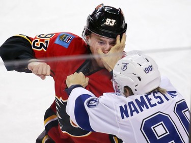 The Calgary Flames' Sam Bennett and the Tampa Bay Lightnings' Vladislav Namestnikov fight during the first period of NHL action at the Scotiabank Saddledome on Wednesday December 14, 2016. GAVIN YOUNG/POSTMEDIA