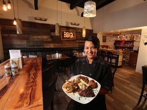 Jenny Burthwright holds a variety of barbecue delights in her new restaurant Jane Bond BBQ on Thursday December 15, 2016.  GAVIN YOUNG/POSTMEDIA