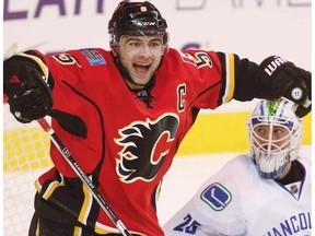 Calgary Flames Mark Giordano celebrates after scoring against Jacob Markstrom of the Vancouver Canucks on Friday, December 23, 2016.