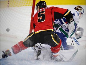 Calgary Flames Mark Giordano scores on Vancouver Canucks goalie Jacob Markstrom on Friday, December 23, 2016.