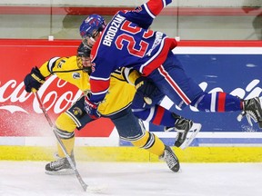 The Regina Pats Preston Brodziak collides with the Arizona Bobcats' Brendan Winslow during Mac's Midget Hockey Tournament action at the Father David Bauer Arena on Tuesday December 27, 2016.  GAVIN YOUNG/POSTMEDIA