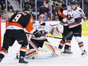 Calgary Hitmen goaltender Cody Porter looks for the rebounding puck during WHL action against the Medicine Hat Tigers at the Scotiabank Saddledome in Calgary on Wednesday December 28, 2016. GAVIN YOUNG/POSTMEDIA