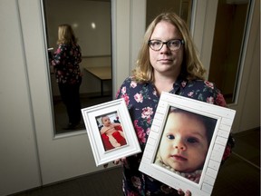 Sarah Cormier holds photos of her daughter Quinn, a victim of SIDS at age four months and 10 days, at the University of Calgary in Calgary, Alta., on Thursday, Dec. 1, 2016. Researchers university's Cumming School of Medicine are a step closer to understanding factors that increase the risks of SIDS, like exposure to cigarette smoke, the cumulative effect of high environmental temperatures, and exposure to infection. Lyle Aspinall/Postmedia Network