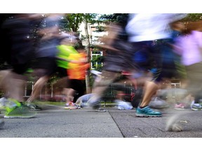 Runners and walkers are a blur as they leave the start  line at the Annual Terry Fox Run held in Calgary, Alta at Eau Claire Market on Sunday September 14, 2014.