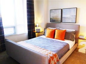 The second bedroom in the Plan L show suite at Bridgeland Crossings II, by GableCraft Homes and Apex CityHomes.