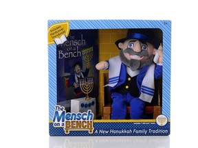 This undated image provided by Neal Hoffman shows a Hanukkah toy called The Mensch on a Bench. Hoffman is Jewish, his wife is Catholic and he came up with the idea for the toy when his son asked for an Elf on the Shelf toy. Hoffman made a prototype of Mensch on a Bench in 2013 and sold out in 10 days; this year he's producing 50,000 to be sold through major toy retailers. It's one of a number of Hanukkah toys and products inspired by Christmas.