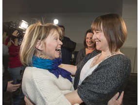 Heart transplant recipient Julie Lyons, left, meets Belynda Garcia, right, and her sister Carolyn Cox-Disney, centre, at Toronto's Lester B. Pearson Airport on Dec. 2, 2016. The two women are the Calgary daughters of Robert John Cox who died after a fall and whose heart Lyons now has.