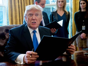 U.S. President Donald Trump speaks before signing an executive order reviving construction of the Keystone XL pipeline.