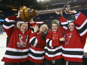 The Rocky Mountain Raiders hoist the cup as they are the champs in the female final at the 2016/17 Mac's AAA Midget Hockey tournament in Calgary, Alberta on Sunday January 1, 2017.  The Raiders won in OT over the Saskatoon Stars.