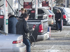 Alberta's carbon tax kicks in on Jan. 1 and some  Edmontonians are lining up at the Costco gas pumps in advance to save that 4.5 cents one more time on December 31, 2016.  Photo by Shaughn Butts / Postmedia Elise Stolte story