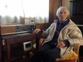 In this photo taken on Sunday, Jan. 8, 2017, 98-year-old Judith Haaland sits next to her decades-old radio set in Stavanger, Norway. In a move likely to be watched closely by other nations, the Norwegian government will begin shutting off the FM signal on Wednesday, Jan. 11, 2017. By the end of the year, national networks will be available only on Digital Audio Broadcast, or DAB. (AP Photos/Mark Lewis)