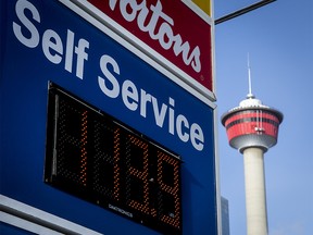 FILE PHOTO: A fuel price sign stands near the Calgary Tower in downtown Calgary, Alta., on Monday, Jan. 2, 2017. The province was on its second day of its new carbon tax. Lyle Aspinall/Postmedia Network