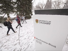 Students walk on the campus of the University of Calgary in Calgary, Alta., on Tuesday, Jan. 31, 2017. A recent University of Calgary survey reveals concerns with student experience and campus culture. Lyle Aspinall/Postmedia Network