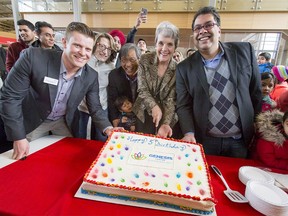 (L-R) Brad Anderson (executive director, Genesis Centre), Helene Weir (CEO, YMCA Calgary), Cesar Cala (manager of Neighbourhood Strategy, United Way), Carol Steiner (founding member, past president, Northeast Centre of Community Society) and Mayor Naheed Nenshi cut a birthday cake at the Genesis Centre in Calgary, Alta., on Saturday, Jan. 7, 2017. The recreation complex was celebrating its fifth anniversary. Lyle Aspinall/Postmedia Network