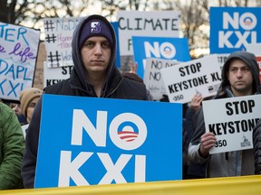 Opponents of the Keystone XL and Dakota Access pipelines hold a rally as they protest US President Donald Trump's executive orders advancing their construction, at Lafayette Park next to the White House in Washington, DC, on January 24, 2017.