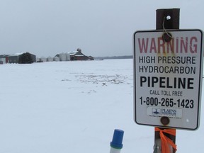 A sign marks a Plains Midstream pipeline on Petrolia Line, just west of Kimball Road, in St. Clair Township on Thursday March 3, 2016 near Sarnia, Ont.. The National Energy Board issued a safety order this week against a pipeline Plains Midstream operates between Sarnia and Windsor.  Paul Morden/Sarnia Observer/Postmedia Network