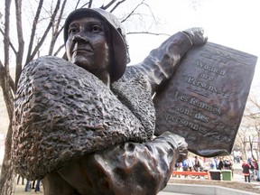 A statue of Nellie McClung stands as part of the Famous Five sculpture at Olympic Plaza in Calgary, Alta., on Saturday, March 19, 2016. McClung was an influential feminist, politician and social activist  in Canada; she died in 1951. Lyle Aspinall/Postmedia Network