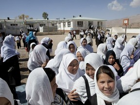 BAMIYAN, AFGHANISTAN - OCTOBER 13:  Afghan girls leave after morning classes at the Markaz high school October 13, 2010 in Bamiyan, Afghanistan. In the peaceful province of Bamiyan girls are able to attend school without any fears, unlike many in the violent Taliban infested areas.