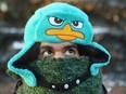 Alex Polanco is bundled up for the cold weather as he walks near downtown Calgary, Alta on Tuesday January 3, 2017. He stays warm by thinking of all the delicious food and fun things to do in Calgary. He is orignally from balmy Miami, FL and says weather in both places has their severe extremes. After a brief reprieve, Calgarians are in for more cold tempertures over the next few days. Jim Wells/Postmedia