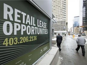 Years of low downtown property values and a struggling economy mean keeping city coffers full will likely mean hiking residential property taxes, which could mean increases of as much as $500 to the average tax bill by 2022. A lease-opportunity sign hangs on a tower in downtown Calgary in this file photo.