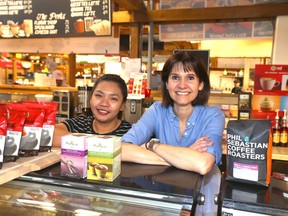 Bernadeth Asuncion, left, and Debbie Mandelbaum pose at Perk 'N'  Beans at the Calgary Farmer's Market on 77 Ave S.E.