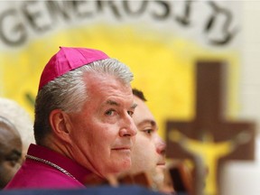 Bishop of Peterborough, Most Rev. William McGrattan listens to comments from Mayor Daryl Bennett during the official opening and blessing ceremony for the new addition at St. Catherine Catholic Public School on Thursday, September 25, 2014 in Peterborough. About 800 schoolchildren, staff and parents attended the special ceremony. Clifford Skarstedt/Peterborough Examiner/QMI Agency