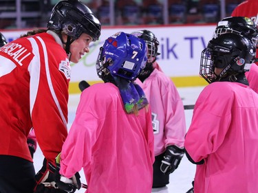 Olympic gold medalist Cassie Campbell-Pascall talks with players as she helps coach novice level girls in the Scotiabank Girls HockeyFest at the Saddledome in Calgary on Sunday January 8, 2017.