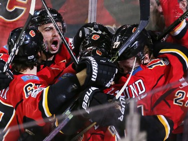 The Calgary Flames celebrate Dougie Hamilton's game winning goal against the San Jose Sharks in the closing minutes of NHL action at the Scotiabank Saddledome in Calgary on Wednesday January 11, 2017.