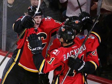 The Calgary Flames celebrate Dougie Hamilton's game winning goal against the San Jose Sharks in the closing minutes of NHL action at the Scotiabank Saddledome in Calgary on Wednesday January 11, 2017.
