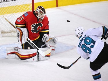 The Calgary Flames Chad Johnson stops this break away scoring chance in the closing minute by the San Jose Sharks' Mikkel Boedker at the Scotiabank Saddledome in Calgary on Wednesday January 11, 2017. The play was similar to a penalty shot Boedker was also stopped on earlier in the period.