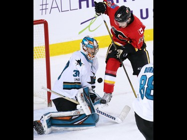 The Calgary Flames' Matthew Tkachuk scores on San Jose Sharks goaltender Aaron Dell during NHL action at the Scotiabank Saddledome in Calgary on Wednesday January 11, 2017. Tkachuk's goal tied the score 2-2 in the closing minute of the second period.