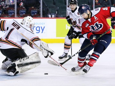 Calgary Hitmen goaltender Trevor Martin stopped this scoring chance from the Lethbridge Hurricanes' Kyle Yewchuk during WHL action at the Scotiabank Saddledome in Calgary on Sunday January 15, 2017. .