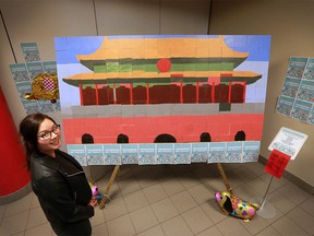 Project Coordinator Alice Lam stands next to the recently unveiled Chinatown Art Project mural on the second floor of the Chinese Cultural Centre on Saturday January 21, 2017. The mural depicting China's Forbidden City was created by community members and then glued together by Lam and artist Mark Vazquez-Mackay. GAVIN YOUNG/POSTMEDIA