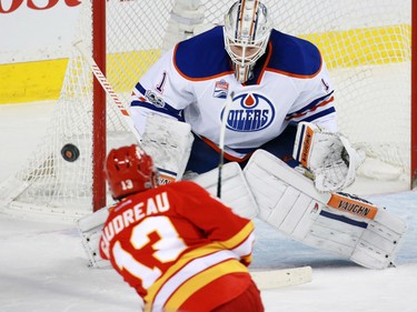 Calgary Flames forward Johnnie Gaudreau gets a shot off on Edmonton Oilers goaltender Laurent Broissoit during NHL action at the Scotiabank Saddledome in Calgary on Saturday January 21, 2017.