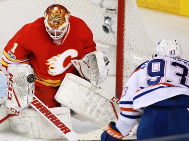 Calgary Flames goaltender Brian Elliott stops this scoring chance from the Edmonton Oilers' Ryan Nugent-Hopkins during NHL action at the Scotiabank Saddledome in Calgary on Saturday January 21, 2017.