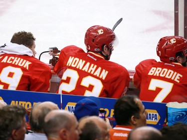 The Calgary Flames Michael Tkachuk, Sean Monahan and TJ Brodie all sit in the penalty box during the third period of during NHL action against the Edmonton Oilers at the Scotiabank Saddledome in Calgary on Saturday January 21, 2017.