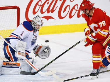 The Calgary Flames' Micheal Ferland looks to catch a rebound as Edmonton Oilers goaltender Laurent Brossoit stops this shot in the third period of during NHL action at the Scotiabank Saddledome in Calgary on Saturday January 21, 2017.