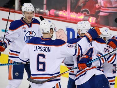 The Edmonton Oilers celebrate scoring against the Calgary Flames during NHL action at the Scotiabank Saddledome in Calgary on Saturday January 21, 2017.