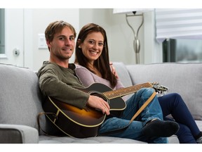 Adam Thibert and Cassia Goncalves in their new townhome by Landmark Homes in Fireside Cochrane by La Vita Land.