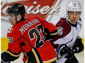 Calgary Flames Sean Monahan and Jarome Iginla of the Colorado Avalanche `jostle for position on Dec. 4, 2014. (Al Charest)
