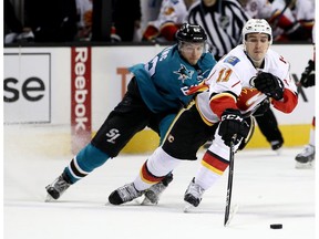 Mikael Backlund of the Calgary Flames skates away from Kevin Labanc of the San Jose Sharks at SAP Center on Dec. 20, 2016. (Getty Images)