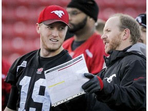 Calgary Stampeders quarterback Bo Levi Mitchell speaks with head coach Dave Dickenson, who has signed a contract that will keep him with the club through the 2020 season. (Lyle Aspinall)