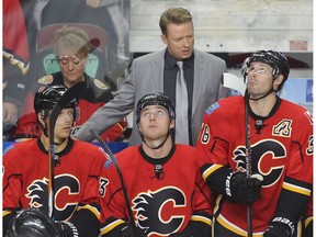 Calgary Flames coach Glen Gulutzan talks to Alex Chiasson, left, Sam Bennett and Troy Brouwer in a previous game. (File)