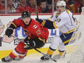 RE-SENT to Correct caption  --  Lance Bouma of the Calgary Flames is chased down around the net by Roman Josi of the Nashville Predators in the second period at the Saddledome Wednesday March 9, 2016.   (Ted Rhodes/Postmedia)