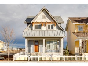 The exterior showing a large front verandah on the Juno show home by Homes by Dream in Vista Crossing.