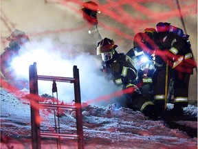 Calgary fire crews work to release the smoke and heat, cutting a hole in the roof as a vent. A house fire broke out in the 4000 block of Benson Road NW on January 27. A 90-year-old man was inside at the time and managed to extricate himself. RYAN MCLEOD FOR POSTMEDIA CALGARY