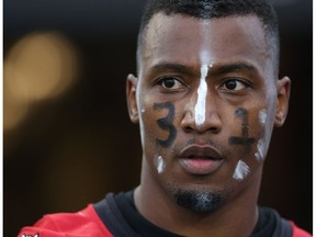 Calgary Stampeders defensive back Tommie Campbell has his face painted during a pre-game warmup with the No. 31, in honour of former teammate Mylan Hicks, who was killed in a shooting outside a Calgary bar last season. (The Canadian Press)