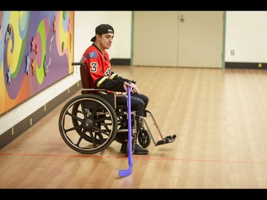 Johnny Gaudreau of the Calgary Flames waits on the sidelines during an annual wheelchair floor hockey game between the Townsend Tigers and the Flames at the Alberta Children's Hospital in Calgary, Alta., on Tuesday, Jan. 31, 2017. The Townsend Tigers, made up of kids who attend Dr. Gordon Townsend School at the hospital, beat the Flames for the 36th year in a row, this year by a 15-0 score. Lyle Aspinall/Postmedia Network