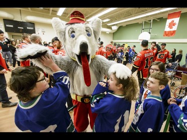 Calgary Flames mascot Harvey the Hound tussles with the Townsend Tigers after an annual wheelchair floor hockey game between the Townsend Tigers and the Flames at the Alberta Children's Hospital in Calgary, Alta., on Tuesday, Jan. 31, 2017. The Townsend Tigers, made up of kids who attend Dr. Gordon Townsend School at the hospital, beat the Flames for the 36th year in a row, this year by a 15-0 score. Lyle Aspinall/Postmedia Network
